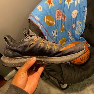 Black and orange Nike running shoes